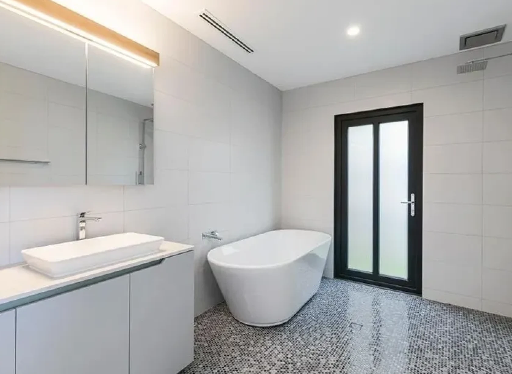 Contemporary bathroom featuring a frosted glass door