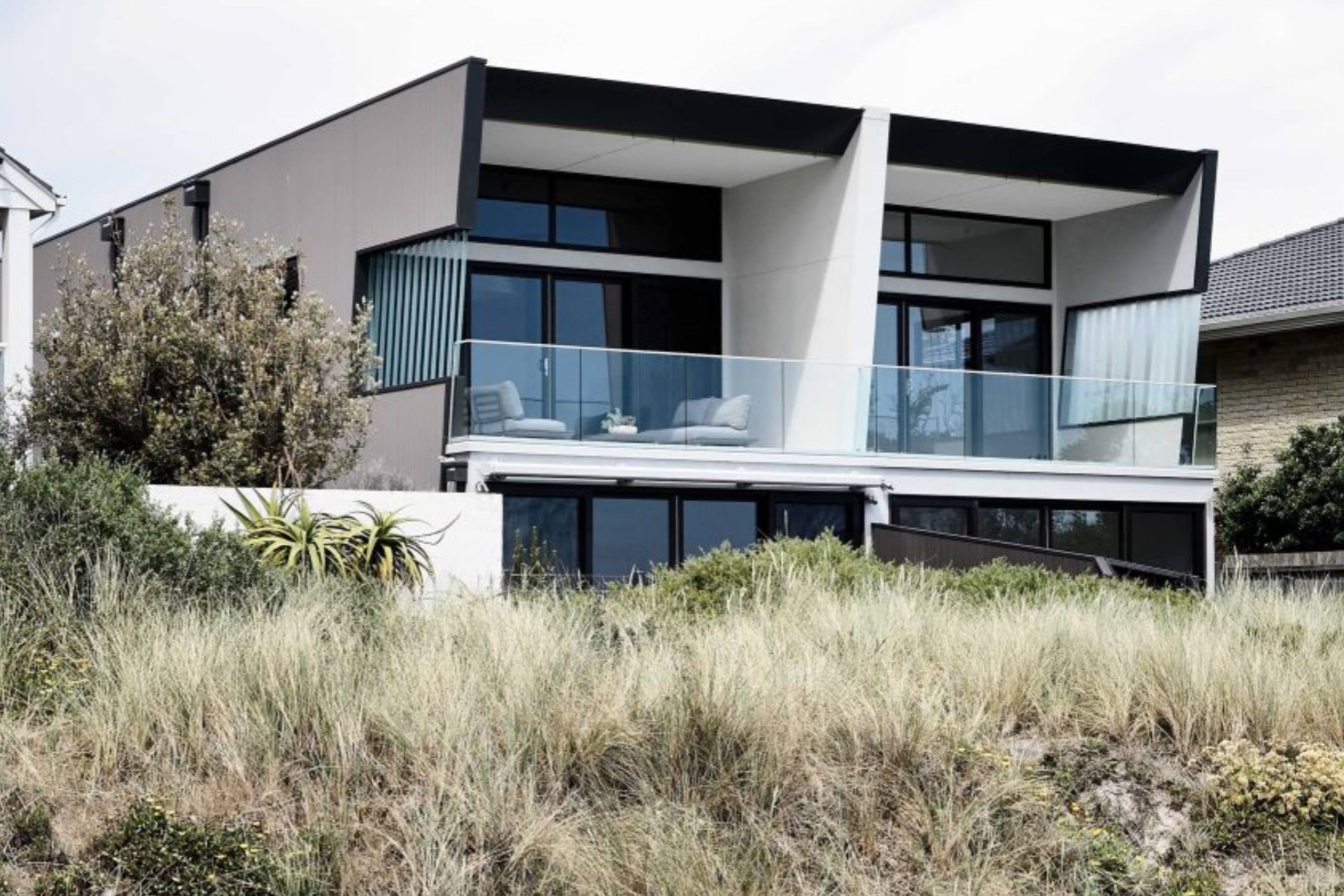 Modern beachfront house with glass balcony