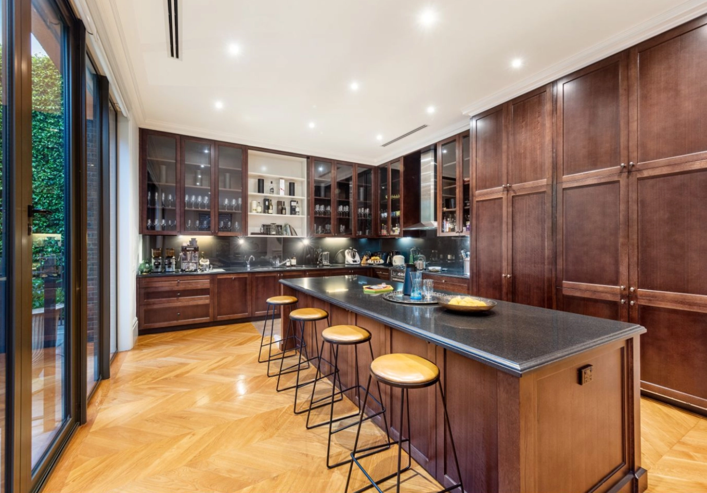 Luxury kitchen with long island and barstools